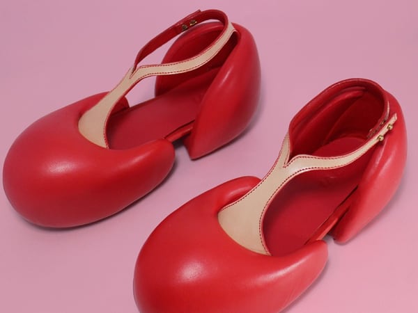 Red shoes on pink background