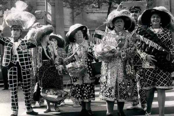 Photo Shows Some of the Pearlies arriving with their Harvest Festival gifts of fruits.