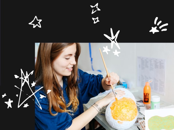 a person painting a sculpture