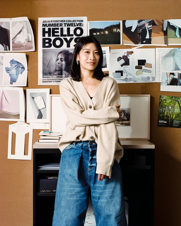 Portrait of Dee Poon Chu Ying at a desk.