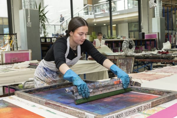 A student in the print and dye workshop