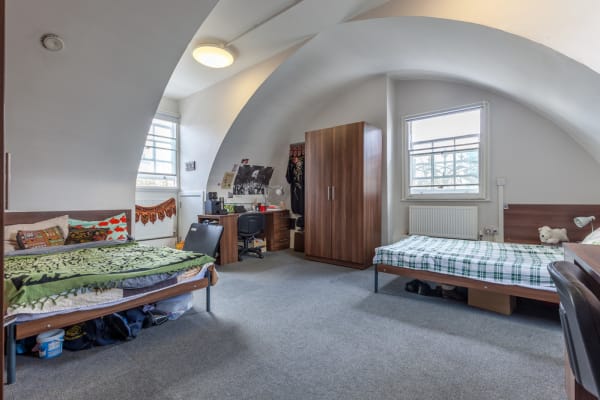 Large twin room with 2 separate 3/4 beds, individual large wardrobes, individual desks, bright window and lots of floor space 