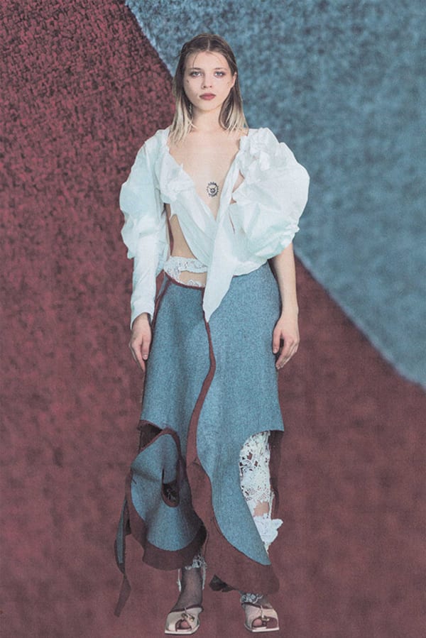 Figure wearing white and blue garments