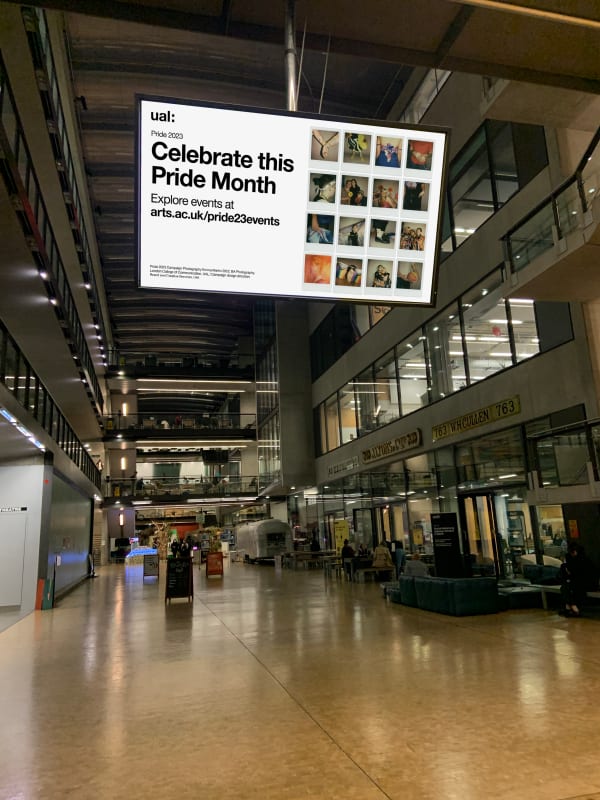 TV displaying event information and Pride campaign creative