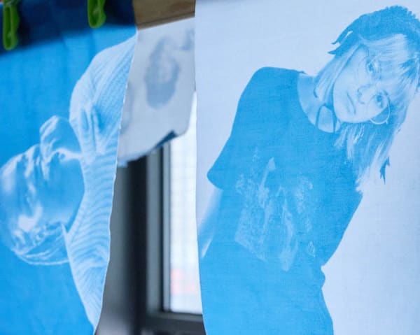 2 cyanotype photographs printed on fabric hanging in the photography studios.