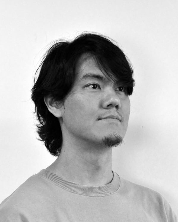 A muted colour head and shoulders side portrait