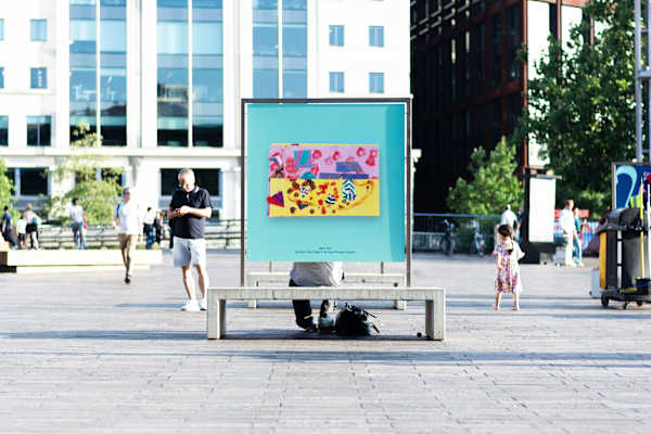 An outdoor artboard in Granary Square featuring a artworks from the exhibition