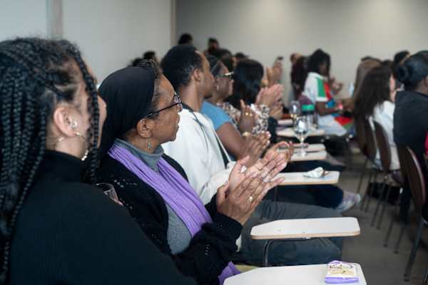 People in a room clapping
