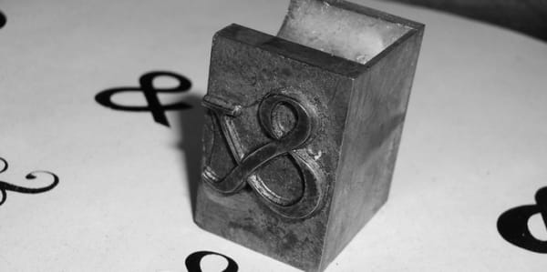 Printing block with ampersand engraving