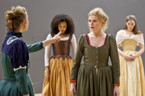 A group of actresses in period dress rehearsing a scene at Drama Centre London 