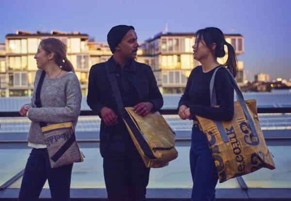 A group of people wearing anti-theft bags