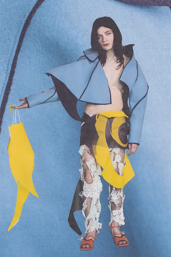 Figure wearing blue, yellow and white garments