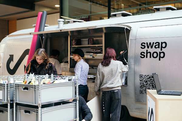 People browse items at a mobile 