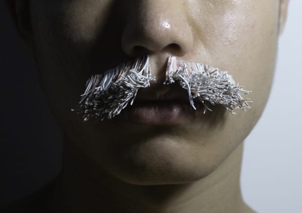 postcard made into a moustache