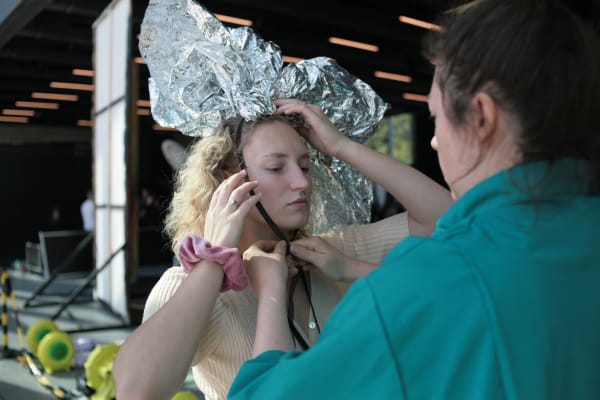 Student with tin foil hat getting ready for performance during the Bauhaus celebrations in Dessau, Germany.