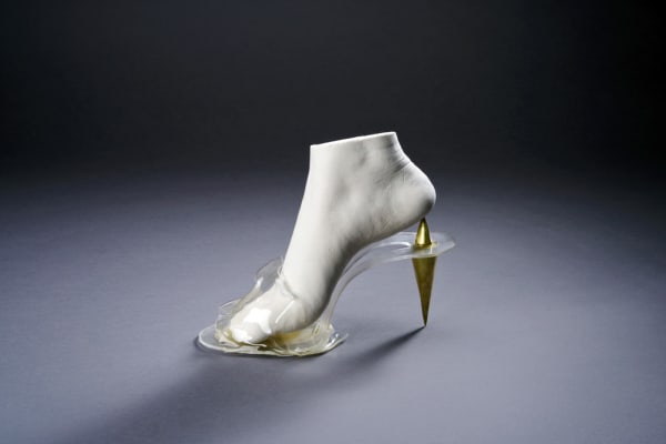 Glass shoe with golden heel 