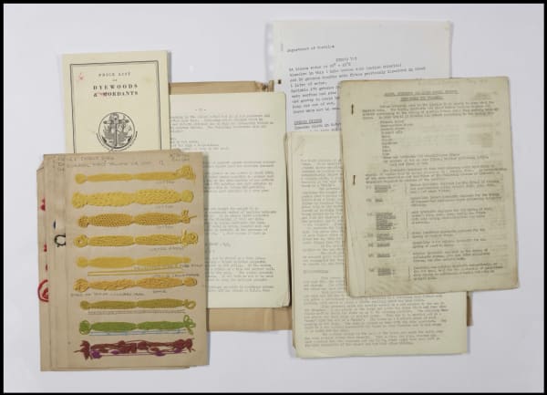 Typed notes on A4 paper and coloured thread