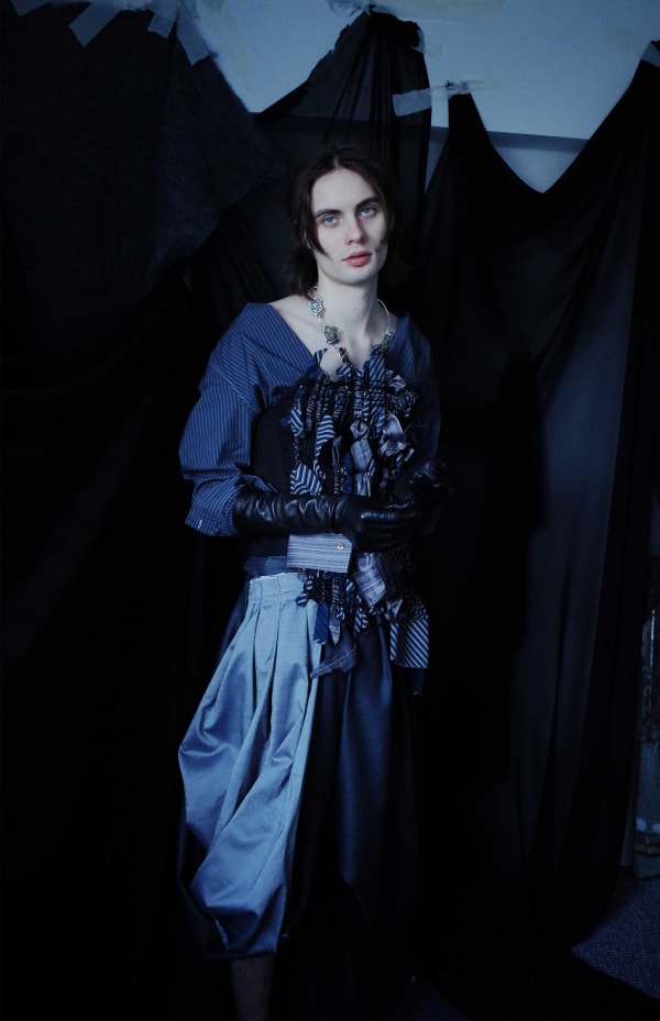 Figure wearing dark garments