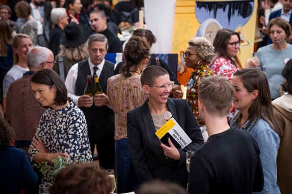 People talking and socialising at the AKO Storytelling Institute launch event at the Royal Opera House