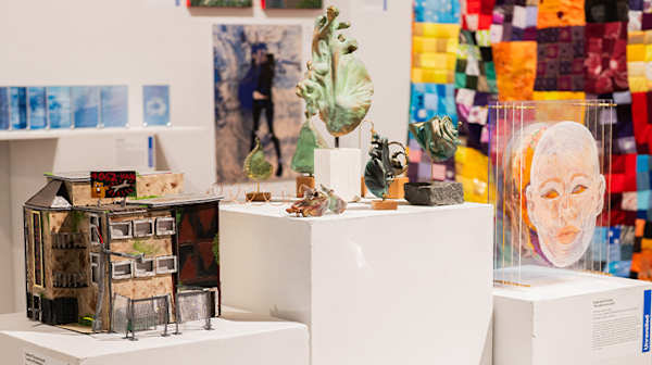 Shot of different artworks on plinths in a gallery