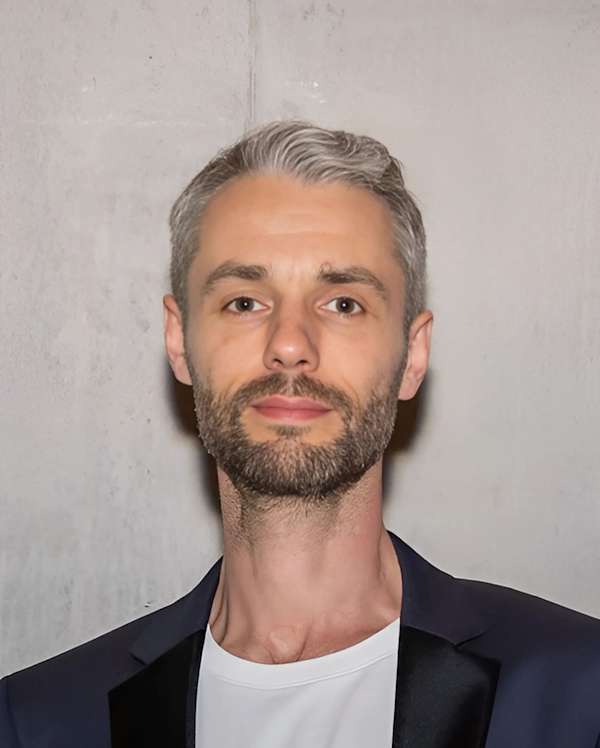 Portrait photo of man with grey hair