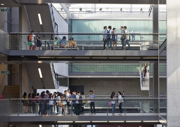 Students milling about on three levels 