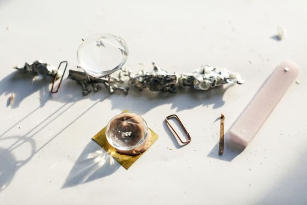 Two crystals and abstract metal items 