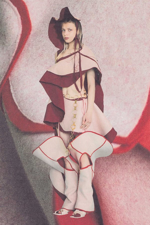 Figure wearing red and white garments