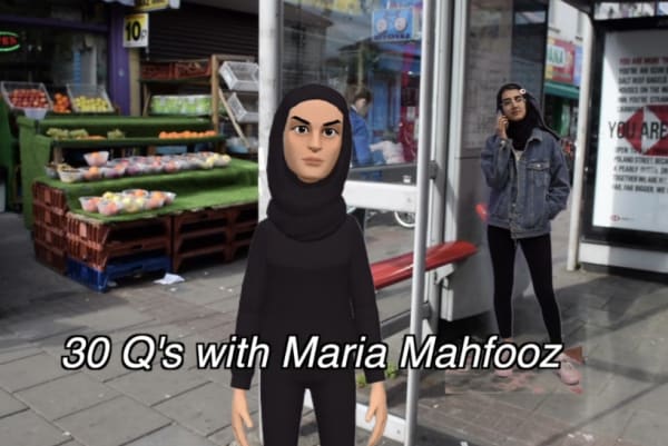 An animated character wearing all black and a hijab stood at a bus stop. Subtitles read: 
