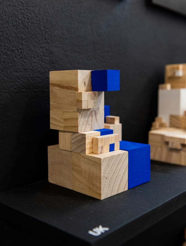 Construction of wooden blocks on a shelf