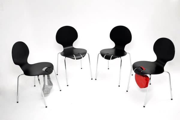 Four black chairs 