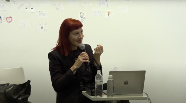 A close-up of Betti presenting