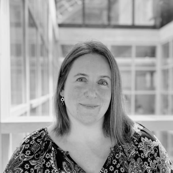 Regina Frei, a Professor in Sustainable and Circular Systems, smiling at the camera, wearing a floral top