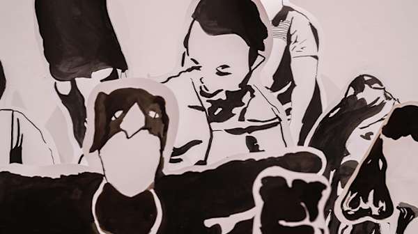 Paper people cutouts in black and white