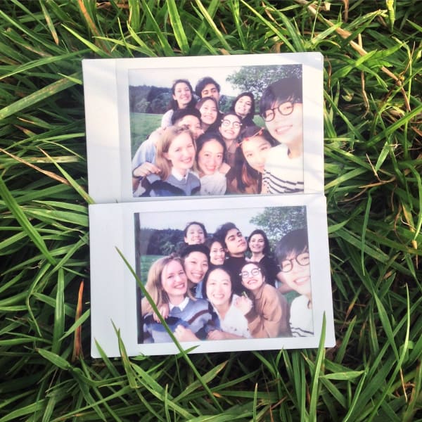 Polaroid of a smiling group of students