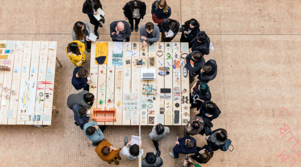 Bird's eye view of people gathered around a table