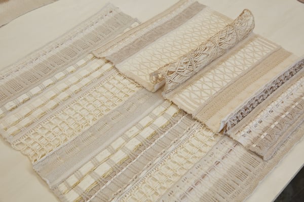 Cream woven tapestry fabric with intricate weaving pattern