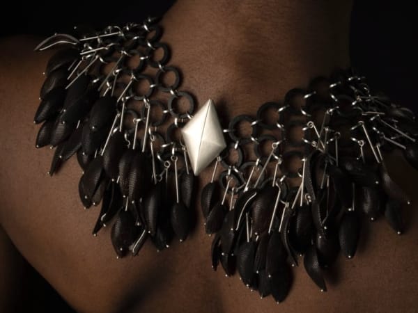 Malika's Palm necklace on a model