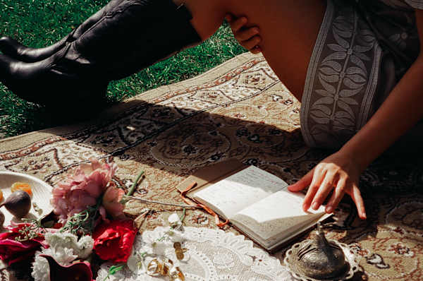  A Designed Dialect Journal - Journal on a carpet, flipped by a hand
