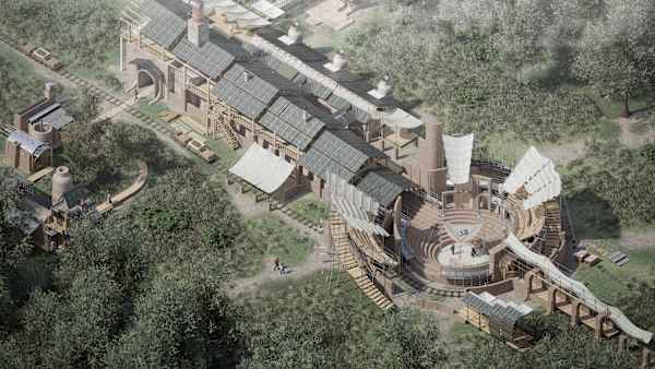 An architectural design rendering viewed from an elevated, bird's-eye perspective. A large, complex building sits within a wooded landscape surrounded by mature trees, grassland and winding paths. The design combines industrial, workshop and performance-space elements. Materials appear to be primarily brick, timber, metal roofing and fabric canopies. Narrow rail tracks run around parts of the site.