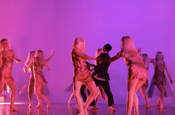 Pink-light in space with dancers