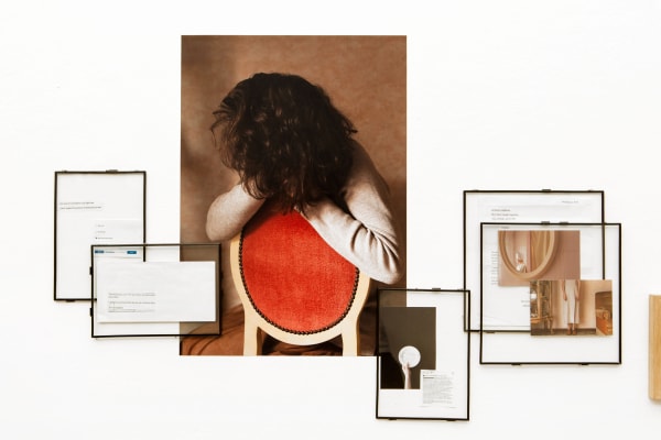 Mixed media photograph of a woman sitting on a red chair
