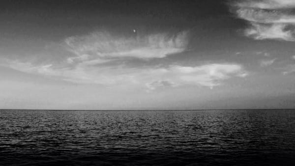 Black and white photograph oh the sea and sky