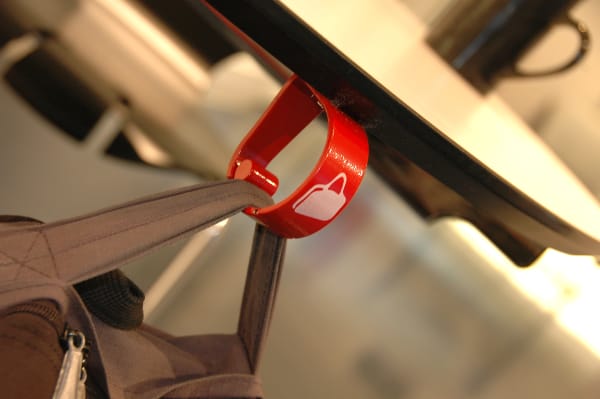 A red clip holding a bag 