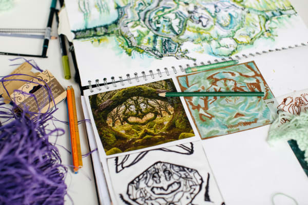 student sketchbook with pencils and string 