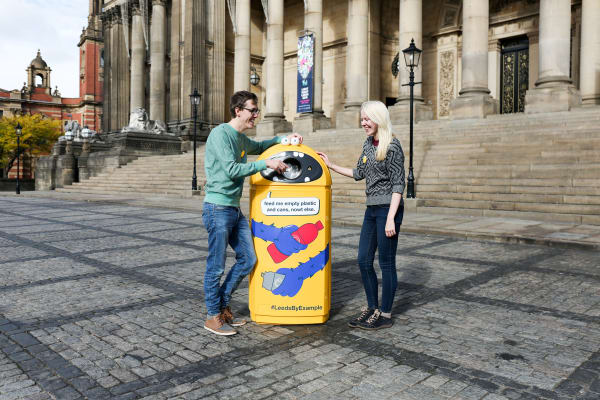 Bin in central city location has 'monster' design on it saying 