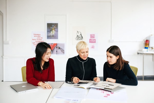 Three women sitting at a table