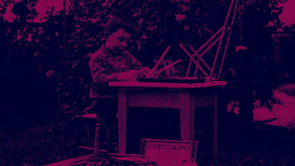 pink and purple duotone photo of a boy at a desk using old instruments 