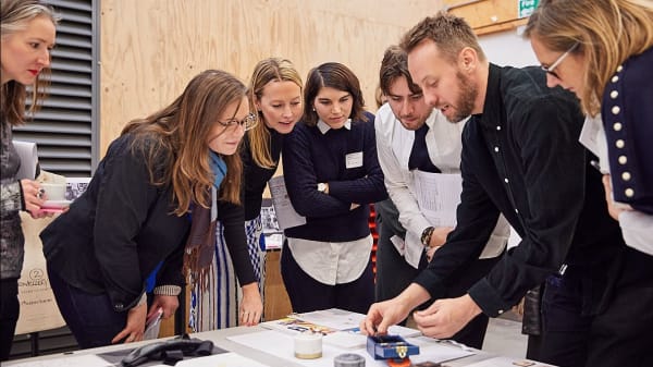Louis Vuitton staff and academics reviewing student work