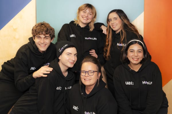 Six people standing in a group